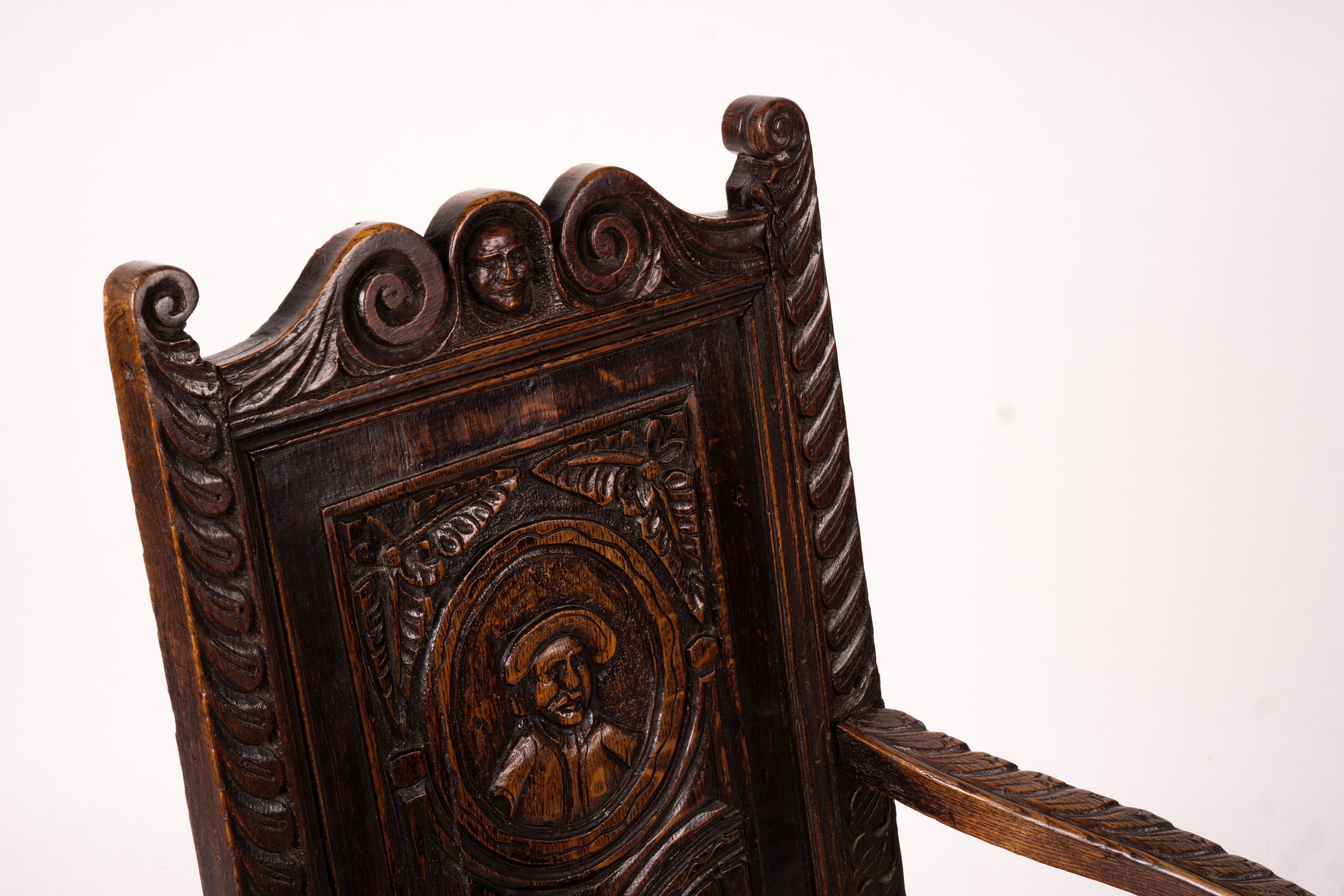 An 18th century style carved oak wainscot chair, width 56cm, depth 60cm, height 101cm